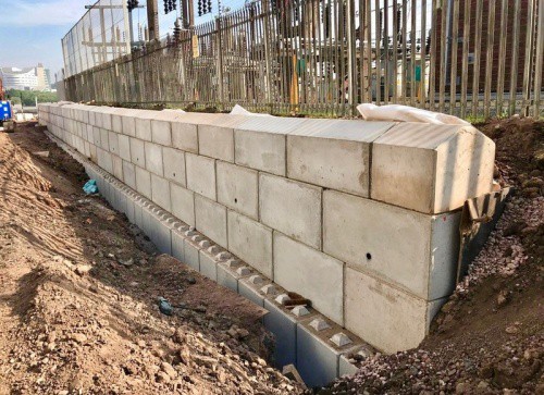 Construction of a retaining wall using Blockwall. (Photo from Blue Planet)