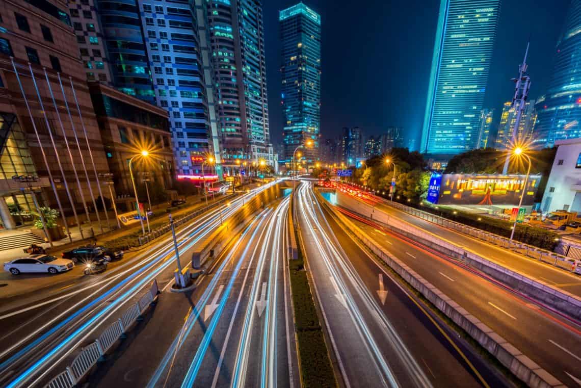 Photo by Peng LIU from Pexels: https://www.pexels.com/photo/timelapse-photography-of-vehicle-on-concrete-road-near-in-high-rise-building-during-nighttime-169677/
