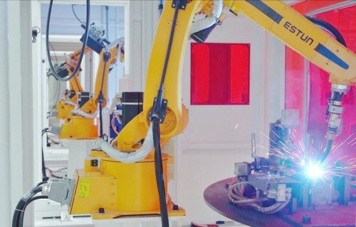 Robots in Luyuan Guigang intelligent factory are assembling products. There are 60 welding robots in the factory now. (PRNewsfoto/The Publicity Department of Gangbei District, Guigang)