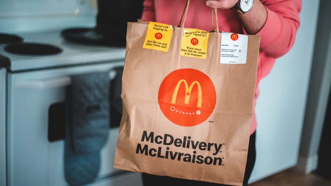 Photo by Erik Mclean: https://www.pexels.com/photo/man-holding-a-mcdonald-s-paper-bag-4111069/