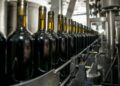 Photo by Lucian Pirvu: https://www.pexels.com/photo/wine-bottles-on-an-industrial-machinery-4176427/