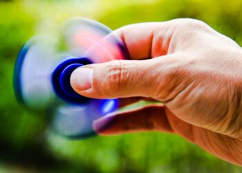 Photo by Tanino: https://www.pexels.com/photo/person-playing-blue-hand-spinner-448539/