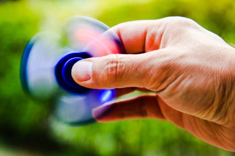 Photo by Tanino: https://www.pexels.com/photo/person-playing-blue-hand-spinner-448539/