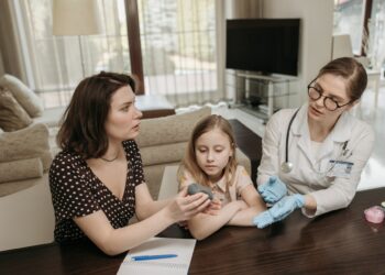 Photo by Pavel Danilyuk: https://www.pexels.com/photo/mother-and-doctor-having-a-conversation-while-holding-gray-device-7653310/