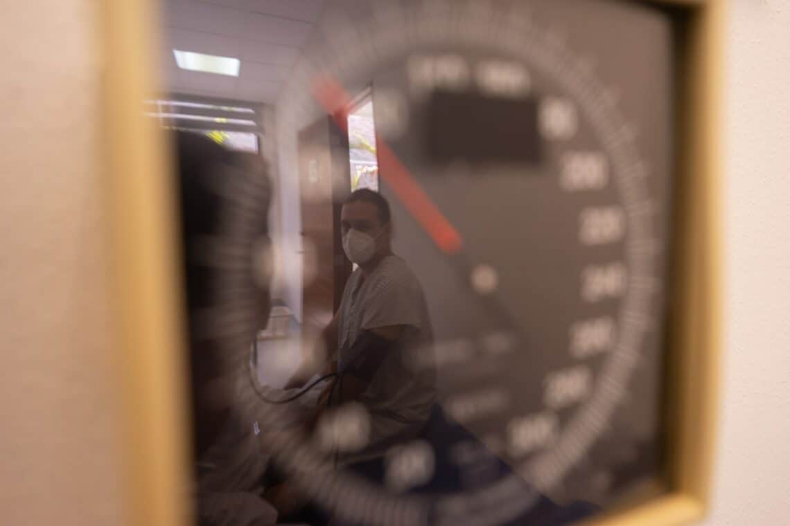 Photo by Los Muertos Crew: https://www.pexels.com/photo/reflection-of-a-patient-getting-his-blood-pressure-8460087/