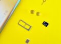 Photo by Andrey Matveev: https://www.pexels.com/photo/a-mobile-phone-with-sim-and-memory-card-on-yellow-surface-14434414/