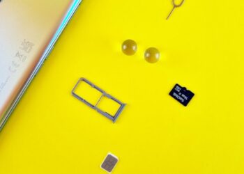 Photo by Andrey Matveev: https://www.pexels.com/photo/a-mobile-phone-with-sim-and-memory-card-on-yellow-surface-14434414/
