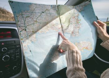 Photo by Dominika Roseclay: https://www.pexels.com/photo/person-wearing-beige-sweater-holding-map-inside-vehicle-1252500/