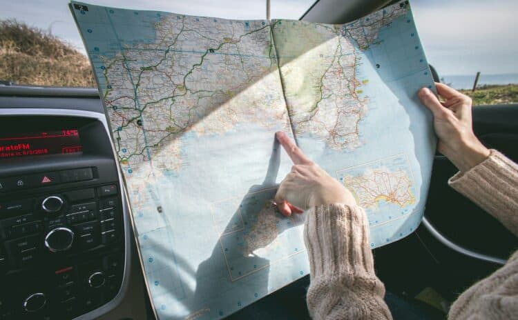 Photo by Dominika Roseclay: https://www.pexels.com/photo/person-wearing-beige-sweater-holding-map-inside-vehicle-1252500/