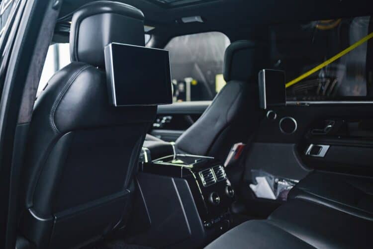Photo by jay pizzle: https://www.pexels.com/photo/modern-car-interior-with-entertainment-system-and-monitors-on-seats-4150596/