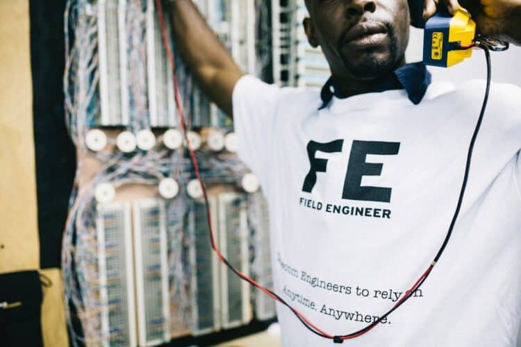 Photo by Field Engineer: https://www.pexels.com/photo/crop-focused-black-engineer-with-handset-checking-connection-442158/