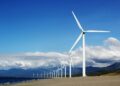 Photo by Kervin Edward Lara: https://www.pexels.com/photo/white-wind-turbines-on-gray-sand-near-body-of-water-3976320/
