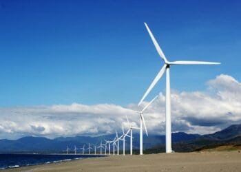Photo by Kervin Edward Lara: https://www.pexels.com/photo/white-wind-turbines-on-gray-sand-near-body-of-water-3976320/