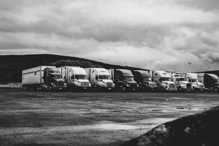 Photo by Kevin Bidwell: https://www.pexels.com/photo/parked-trucks-under-clouds-2348359/