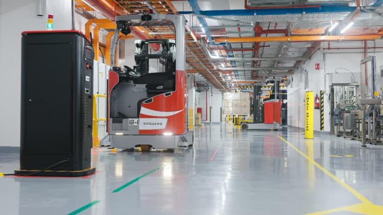 XSQUARE's autonomous forklifts seamlessly navigate Coca-Cola Singapore's facility, executing warehouse tasks with efficiency and precision.
