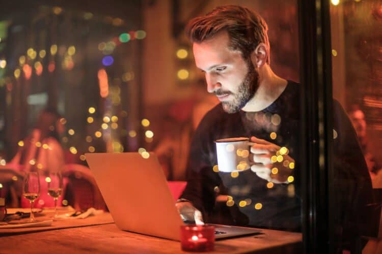 Photo by Andrea Piacquadio: https://www.pexels.com/photo/man-holding-mug-in-front-of-laptop-842548/