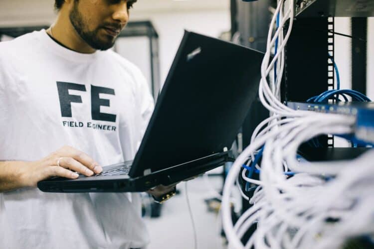 Photo by Field Engineer: https://www.pexels.com/photo/serious-ethnic-field-engineer-examining-hardware-and-working-on-laptop-442152/