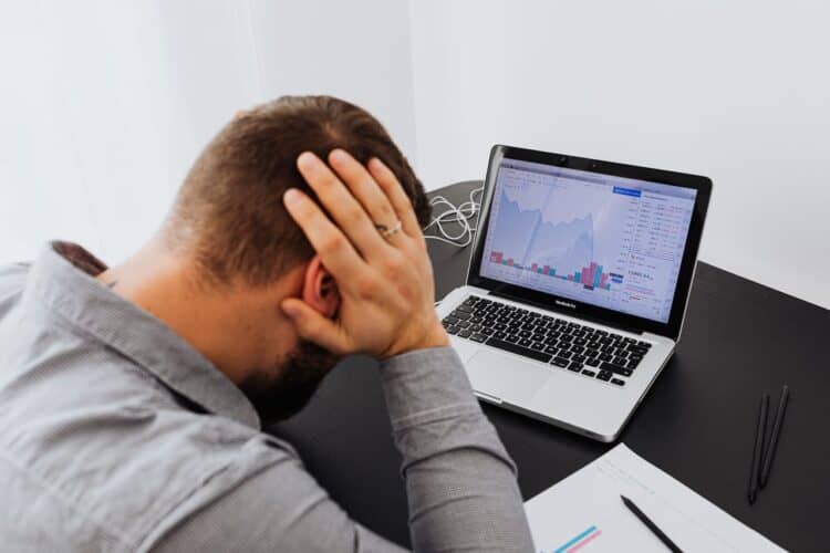 Photo by Karolina Kaboompics: https://www.pexels.com/photo/man-with-laptop-on-desk-terrified-by-stock-market-chart-5717791/