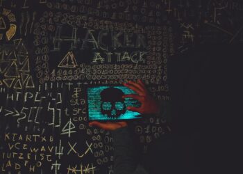 Photo by Lucas Andrade: https://www.pexels.com/photo/a-person-holding-a-tablet-device-with-skull-image-near-blackboard-14066351/