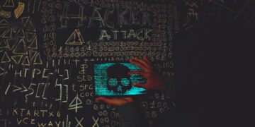 Photo by Lucas Andrade: https://www.pexels.com/photo/a-person-holding-a-tablet-device-with-skull-image-near-blackboard-14066351/