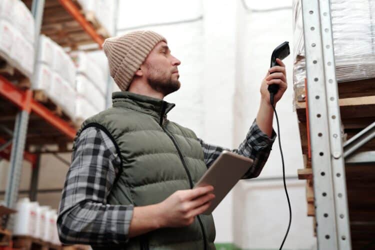 Photo by Tiger Lily: https://www.pexels.com/photo/photo-of-a-man-scanning-products-in-a-warehouse-4483942/