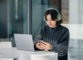 Photo by Julio Lopez: https://www.pexels.com/photo/young-woman-using-laptop-with-headphones-indoors-29179707/