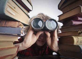 Photo by Andrea Piacquadio: https://www.pexels.com/photo/man-using-binoculars-in-between-stack-of-books-3769697/