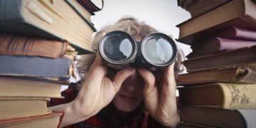 Photo by Andrea Piacquadio: https://www.pexels.com/photo/man-using-binoculars-in-between-stack-of-books-3769697/