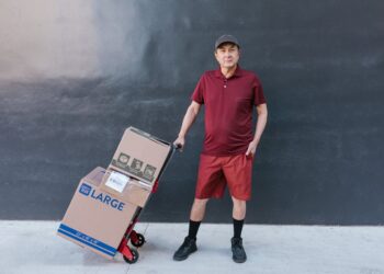 Photo by RDNE Stock project: https://www.pexels.com/photo/man-standing-with-delivery-boxes-7362917/