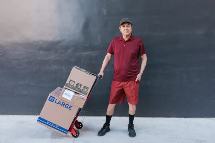 Photo by RDNE Stock project: https://www.pexels.com/photo/man-standing-with-delivery-boxes-7362917/