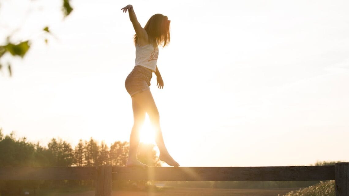 Photo by Sebastian V.: https://www.pexels.com/photo/woman-walking-on-fence-1548769/