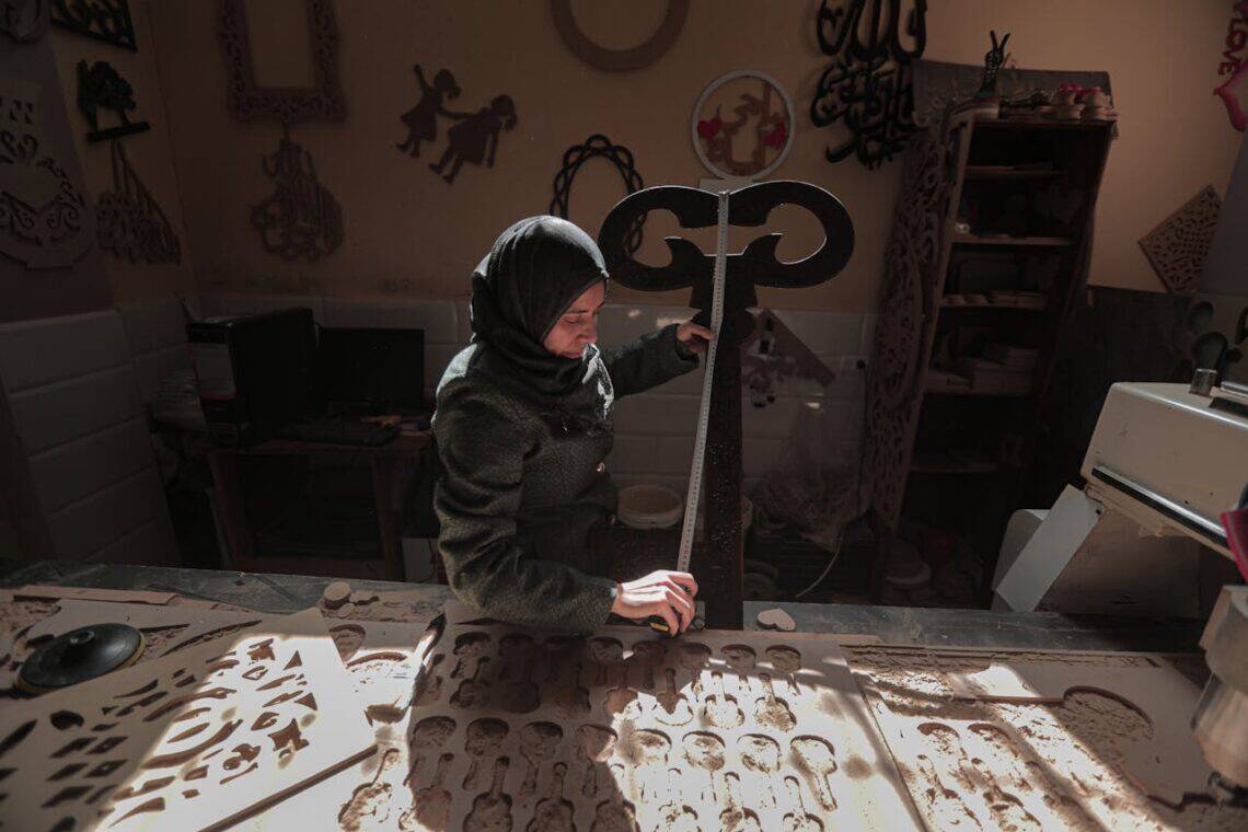 Photo by Hosny salah: https://www.pexels.com/photo/woman-in-hijab-working-in-workshop-13748649/