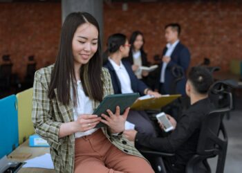 Photo by Mikhail Nilov: https://www.pexels.com/photo/woman-holding-a-tablet-at-the-office-8101971/