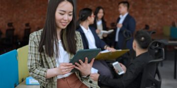 Photo by Mikhail Nilov: https://www.pexels.com/photo/woman-holding-a-tablet-at-the-office-8101971/