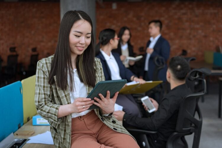 Photo by Mikhail Nilov: https://www.pexels.com/photo/woman-holding-a-tablet-at-the-office-8101971/