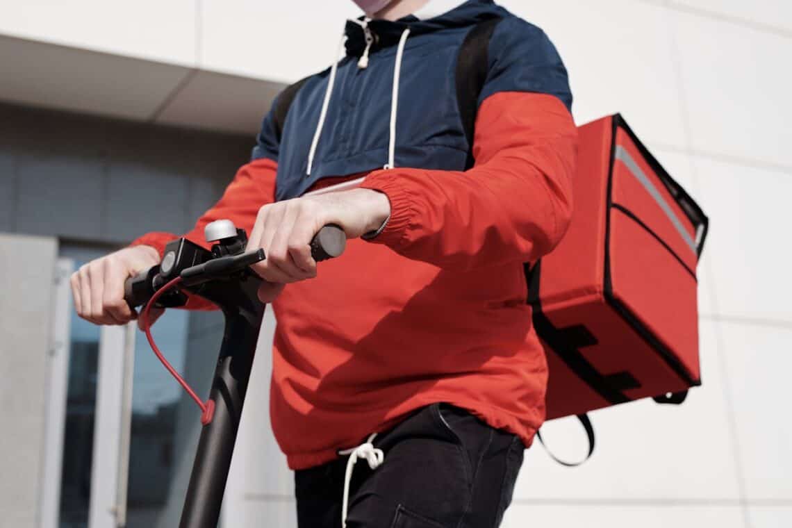 Photo by Norma Mortenson: https://www.pexels.com/photo/man-in-red-and-black-jacket-holding-black-and-red-scooter-4393256/