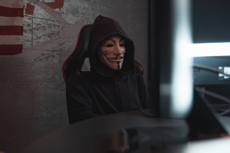 Photo by Tima Miroshnichenko: https://www.pexels.com/photo/person-in-black-hoodie-hacking-a-computer-system-5380647/