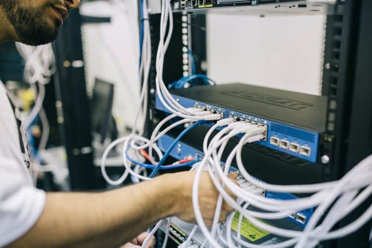 Photo by Field Engineer: https://www.pexels.com/photo/electronics-engineer-fixing-cables-on-server-442150/