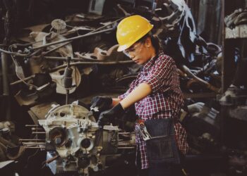 Photo by Chevanon Photography: https://www.pexels.com/photo/woman-wears-yellow-hard-hat-holding-vehicle-part-1108101/