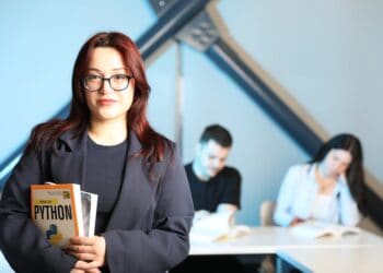 Photo by Yusuf Timur Çelik: https://www.pexels.com/photo/young-professional-holding-python-book-in-class-32213227/