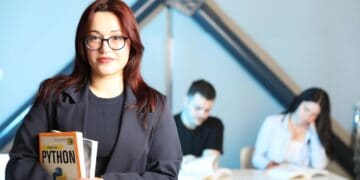 Photo by Yusuf Timur Çelik: https://www.pexels.com/photo/young-professional-holding-python-book-in-class-32213227/