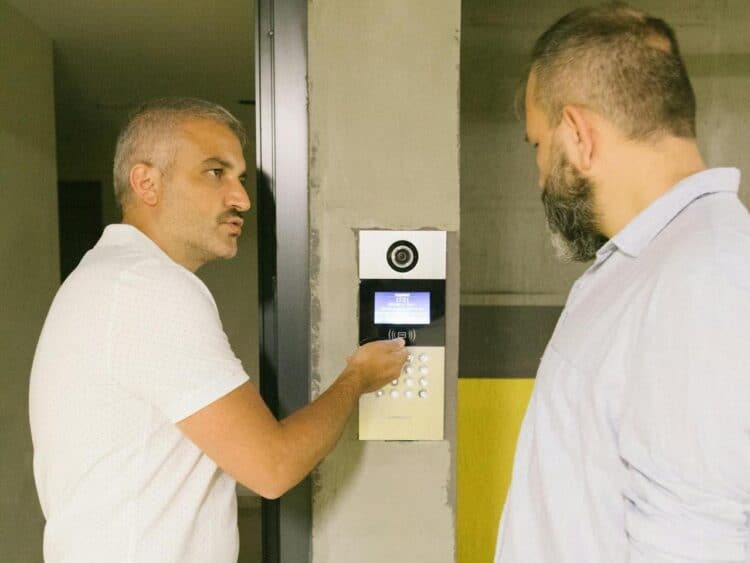 Photo by Meruyert Gonullu: https://www.pexels.com/photo/a-man-showing-a-digital-keypad-on-a-concrete-wall-8978630/