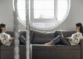 Photo by Pavel Danilyuk: https://www.pexels.com/photo/a-reflection-of-a-woman-using-laptop-while-sitting-on-sofa-7190925/