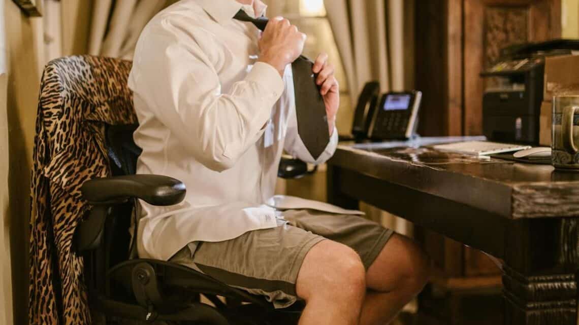 Photo by RDNE Stock project: https://www.pexels.com/photo/a-man-in-white-long-sleeves-sitting-on-the-chair-while-fixing-his-necktie-6517305/