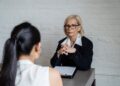 Photo by Timur Weber: https://www.pexels.com/photo/blonde-woman-sitting-with-her-hands-together-8560024/