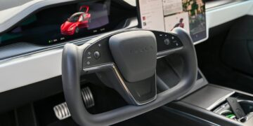 Photo by Vladimir Srajber: https://www.pexels.com/photo/steering-wheel-and-screens-in-tesla-car-interior-17345649/