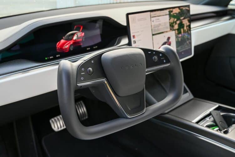 Photo by Vladimir Srajber: https://www.pexels.com/photo/steering-wheel-and-screens-in-tesla-car-interior-17345649/