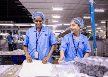 Photo by EqualStock IN: https://www.pexels.com/photo/smiling-factory-workers-in-a-textile-warehouse-31112188/
