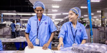 Photo by EqualStock IN: https://www.pexels.com/photo/smiling-factory-workers-in-a-textile-warehouse-31112188/