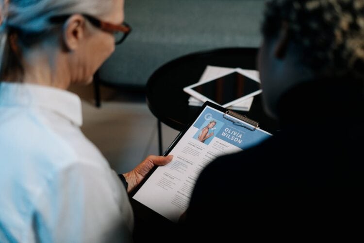 Photo by cottonbro studio: https://www.pexels.com/photo/woman-holding-a-clipboard-with-resume-5989941/